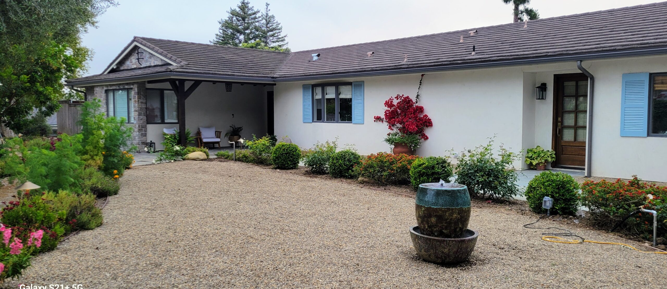 Complete exterior remodel, stucco, shutters, crished pebbles, and flgastone walkways.