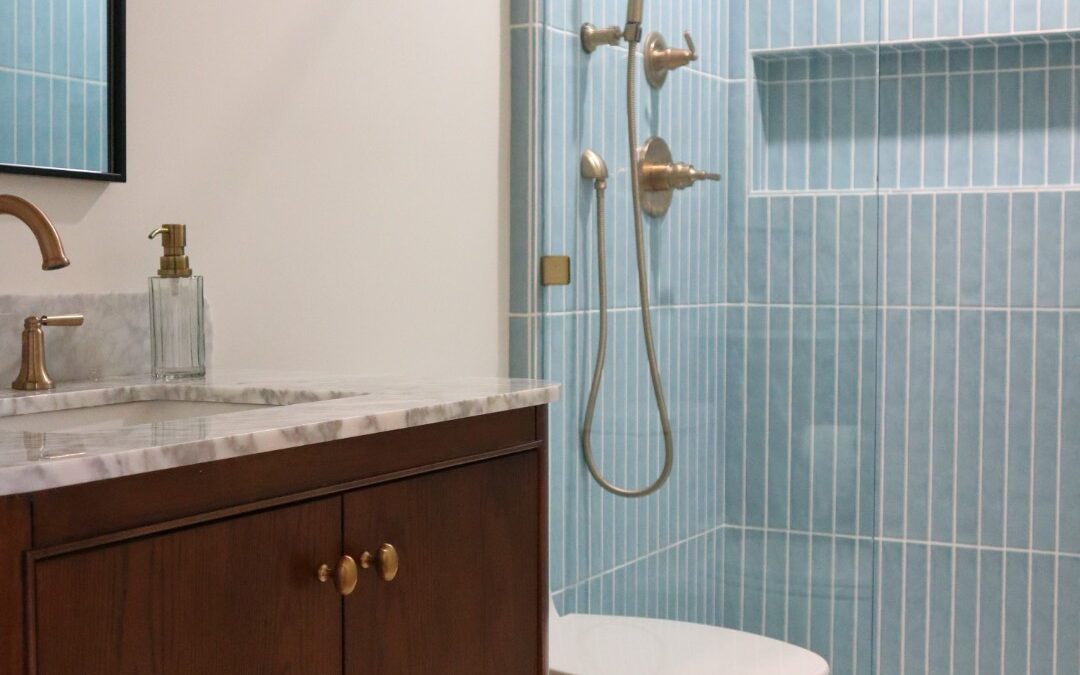 Full bathroom remodel in Camarillo, CA featuring Edward Martin Maisie Ocean tile, Reagan Dove hexagon flooring, and a Collette Cinnamon Oak vanity by All Pro Construction, Inc